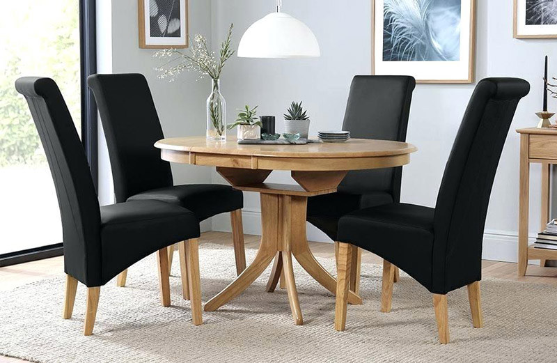 oak-table-with-black-chairs-round-extending-dining-4-6-and-friday.jpg